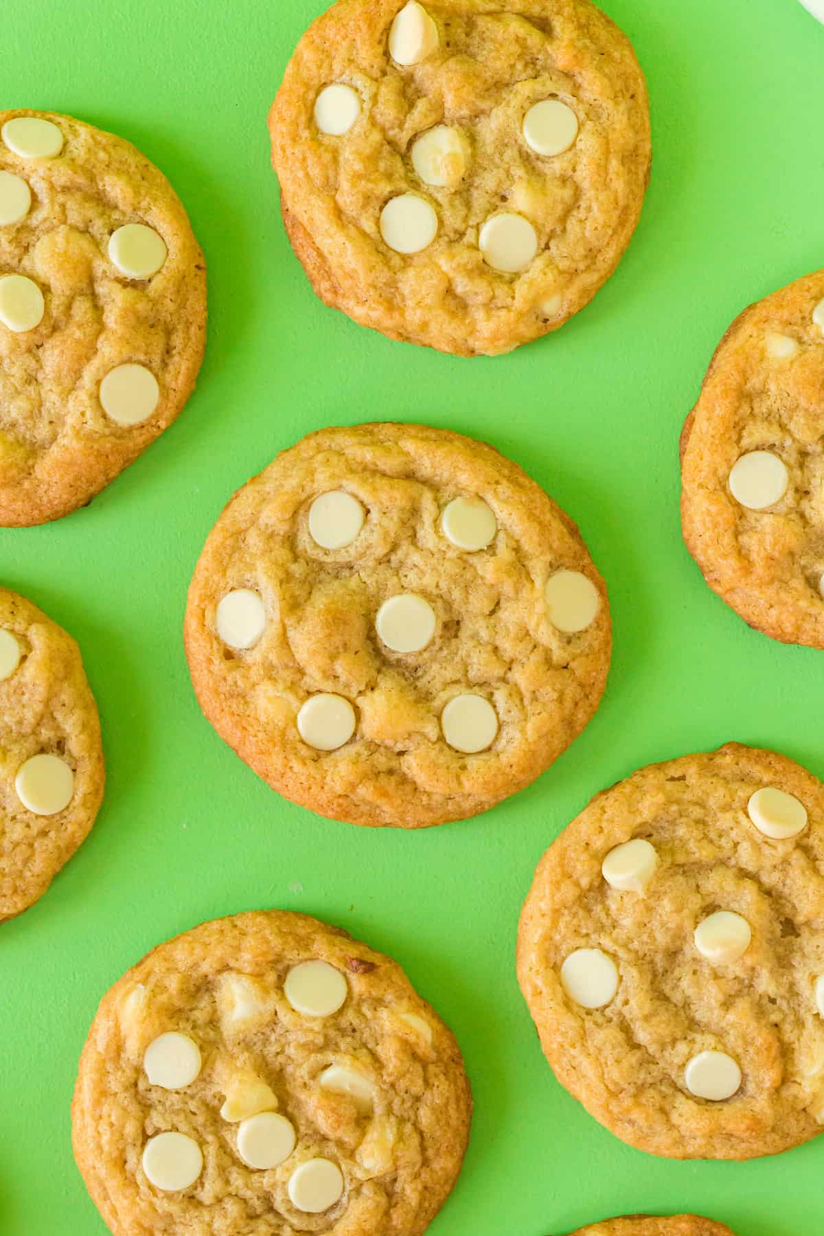 Banana Cookies with White Chocolate Chips on green background.