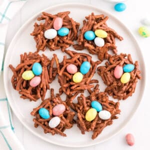 No-bake chocolate birds nest cookies with colorful eggs in the center.