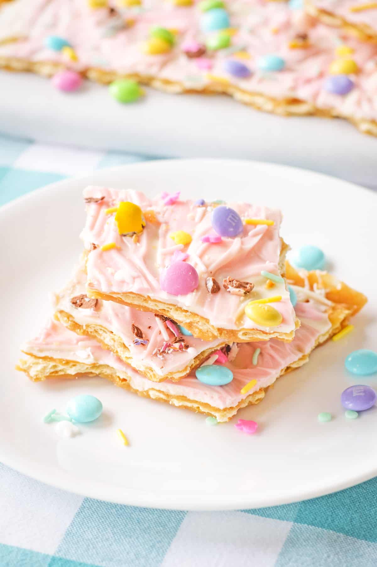 Easter bark (aka saltine toffee) with pink chocolate and pastel candies.