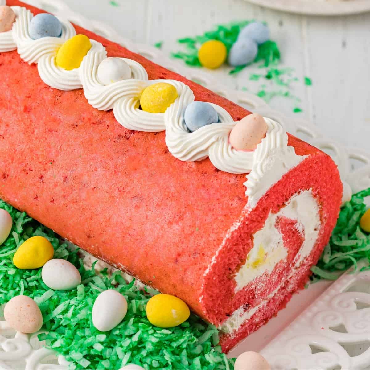 Easter cake roll with whipped cream filling and mini eggs.