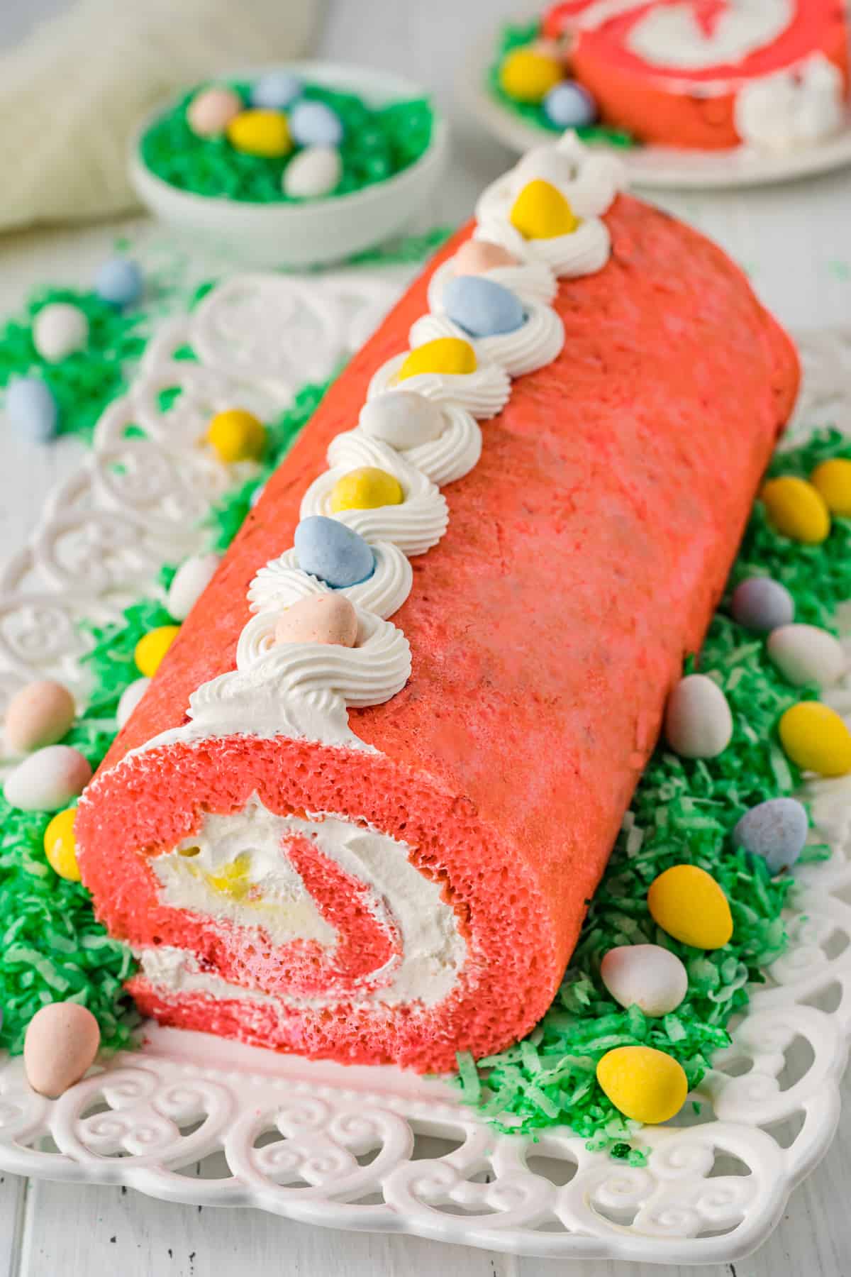 Easter strawberry cake roll with whipped cream filling and cadbury mini eggs.