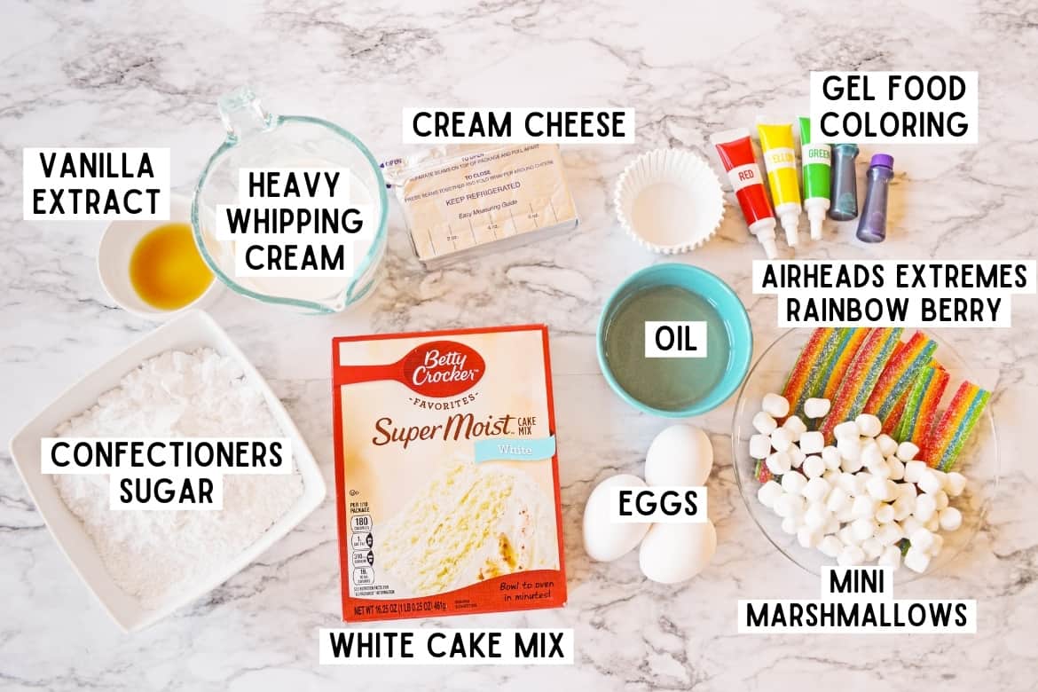 vanilla extract, heavy whipping cream, cream cheese, gel food coloring, white cake mix, confectioners sugar, 3 eggs, oil, mini marshamellows, rainbow airhead candy