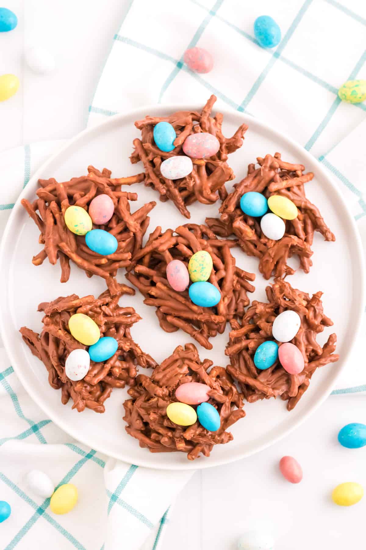 No-bake chocolate birds nest cookies with colorful eggs in the center.