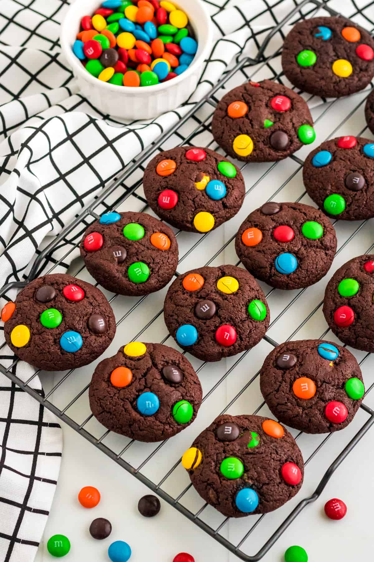 M&M Chocolate cake mix cookies on cooling rack.