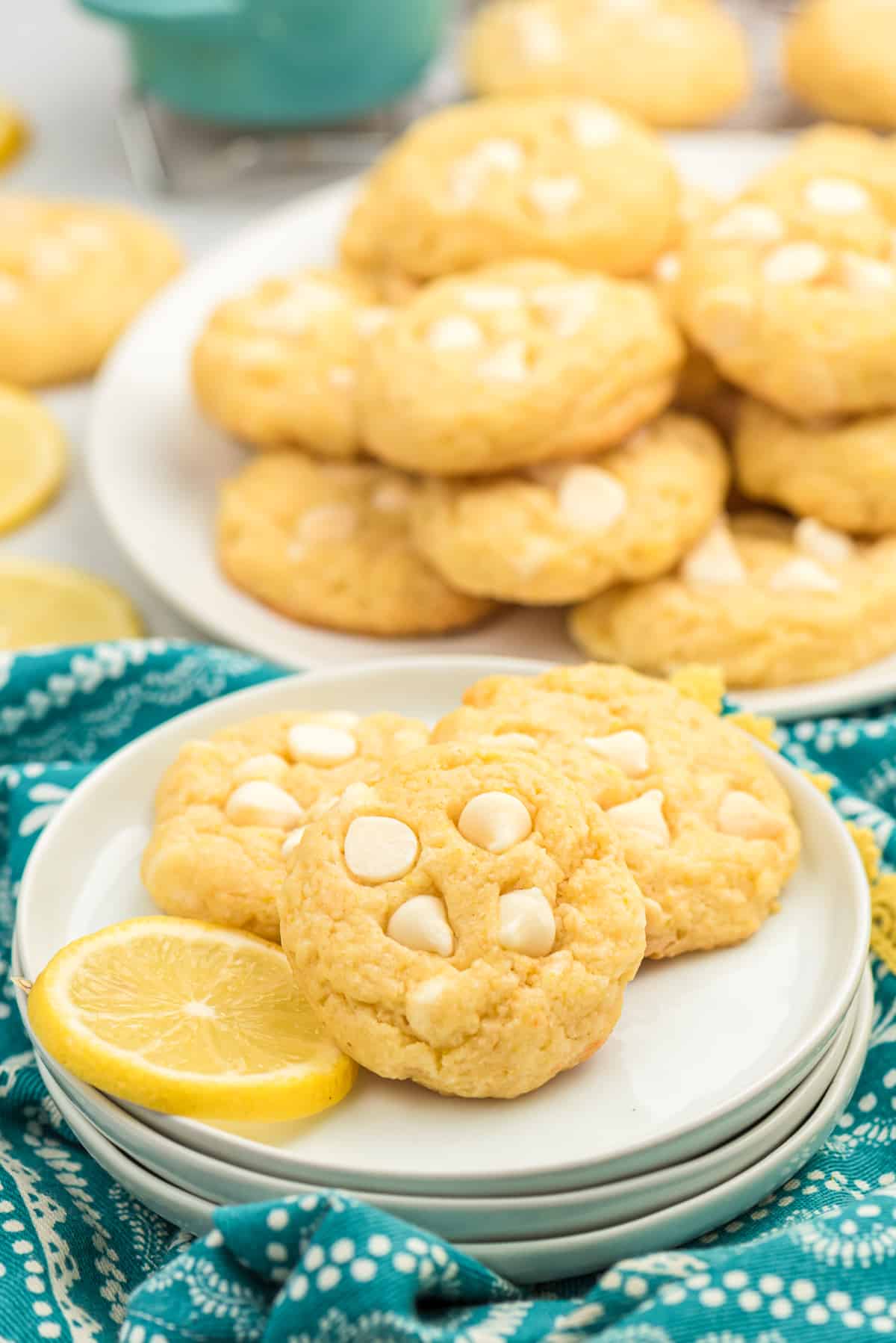 Lemon cookies on plate with lemon slice.