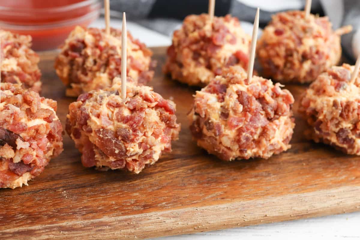 Mini buffalo chicken cheese balls with toothpicks in each one.