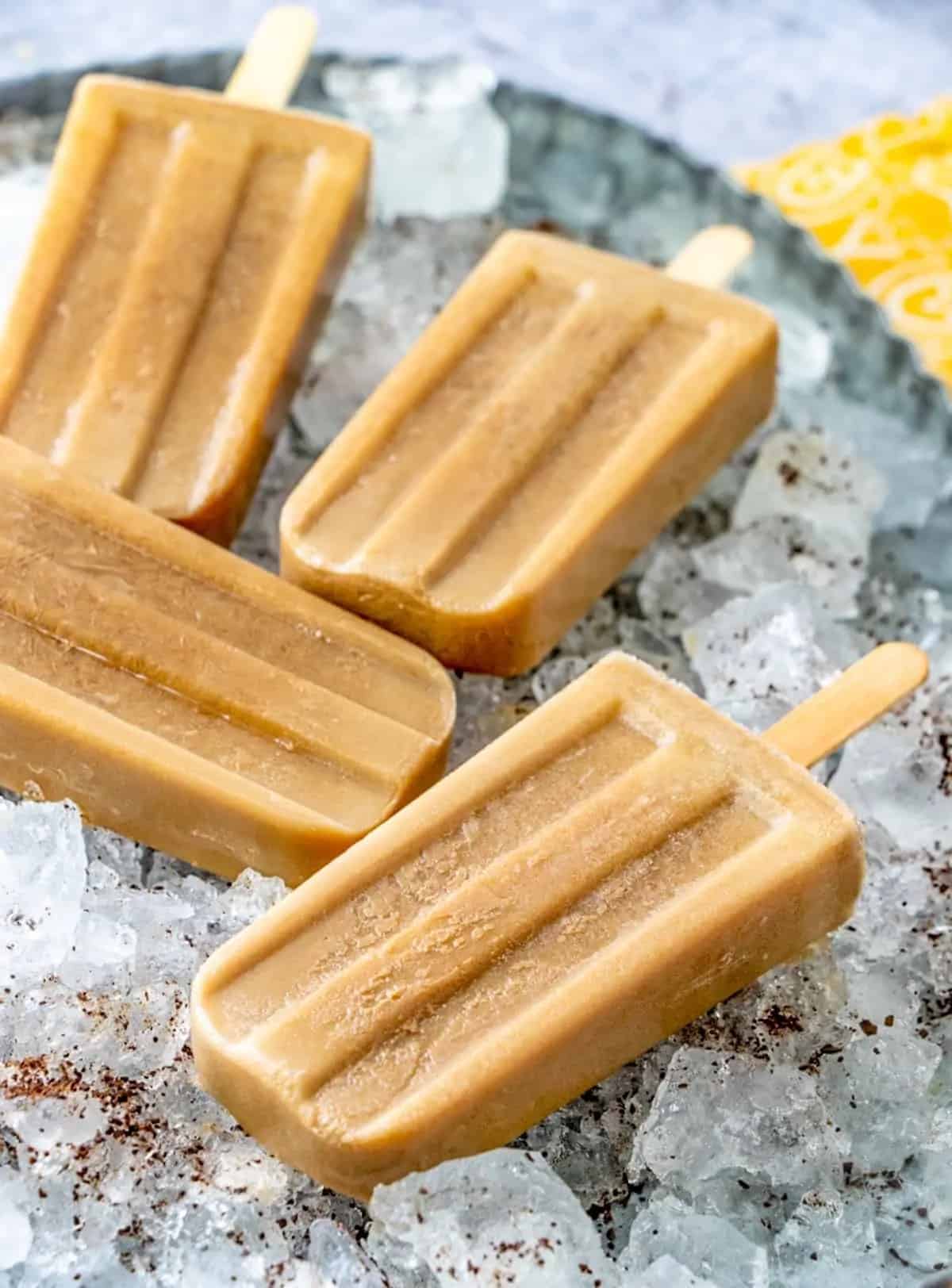 Coffee popsicles on bed of ice.