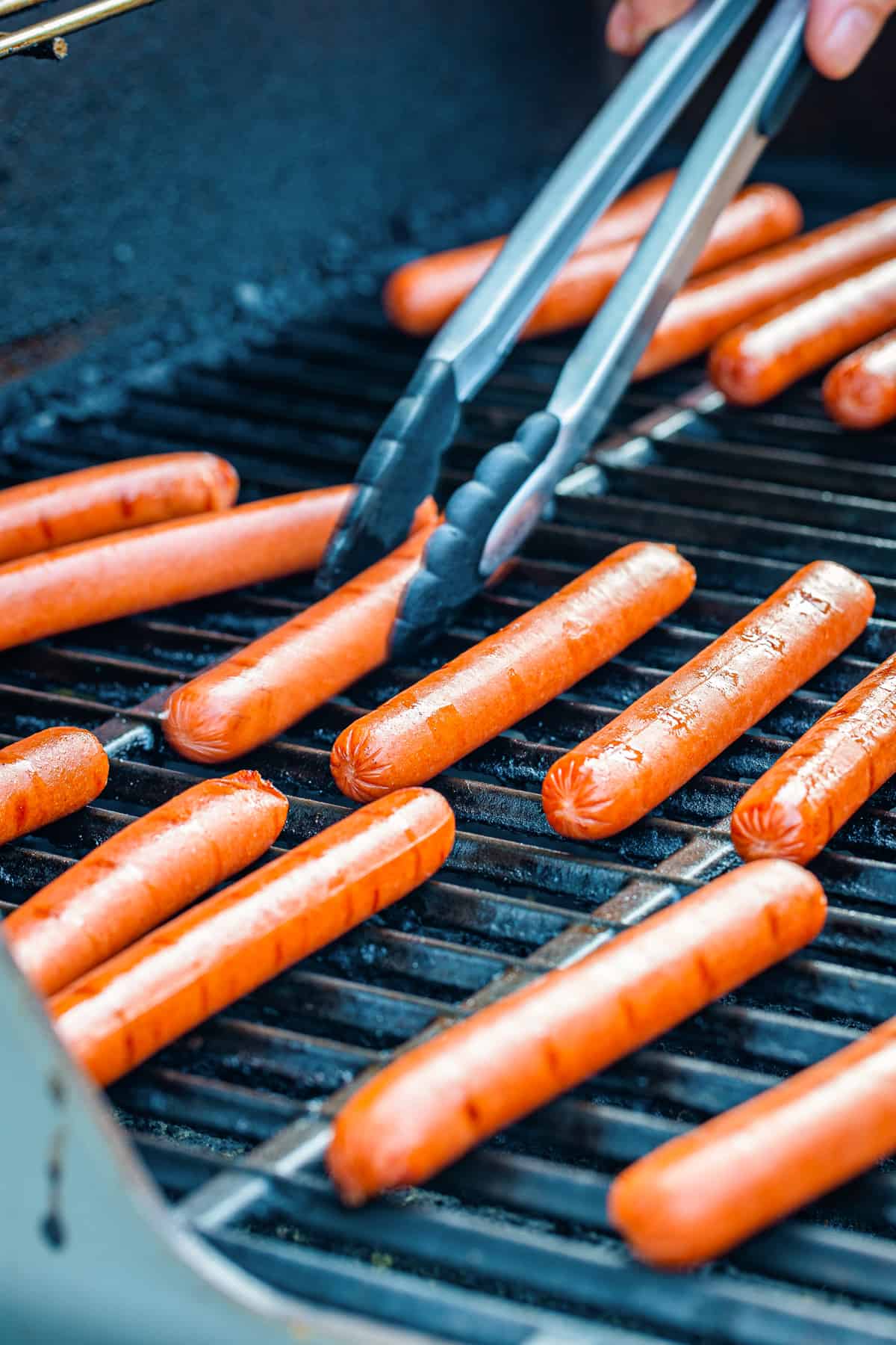 Hot dogs on the grill.