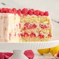 Lemon raspberry cake with three layers of yellow cake and a raspberry filling and frosting.