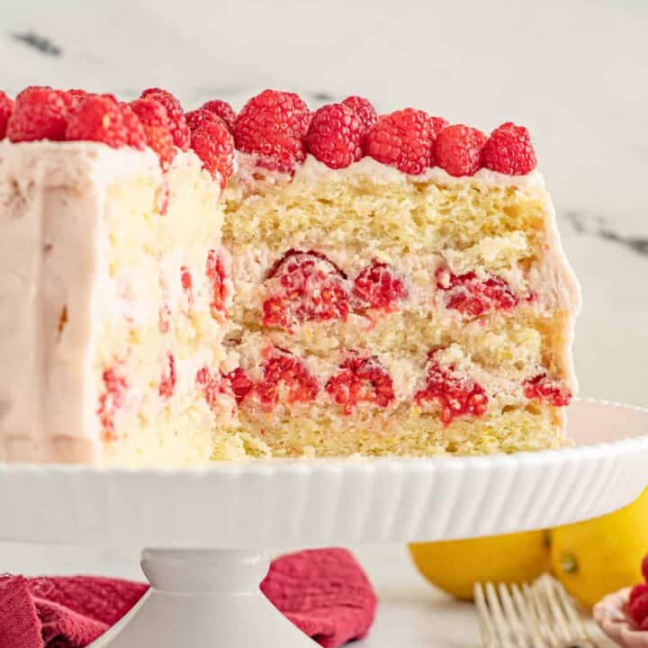 Lemon raspberry cake with three layers of yellow cake and a raspberry filling and frosting.