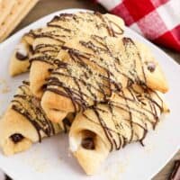 S'mores crescent rolls with marshmallows, melted chocolate, and graham cracker crumbs.