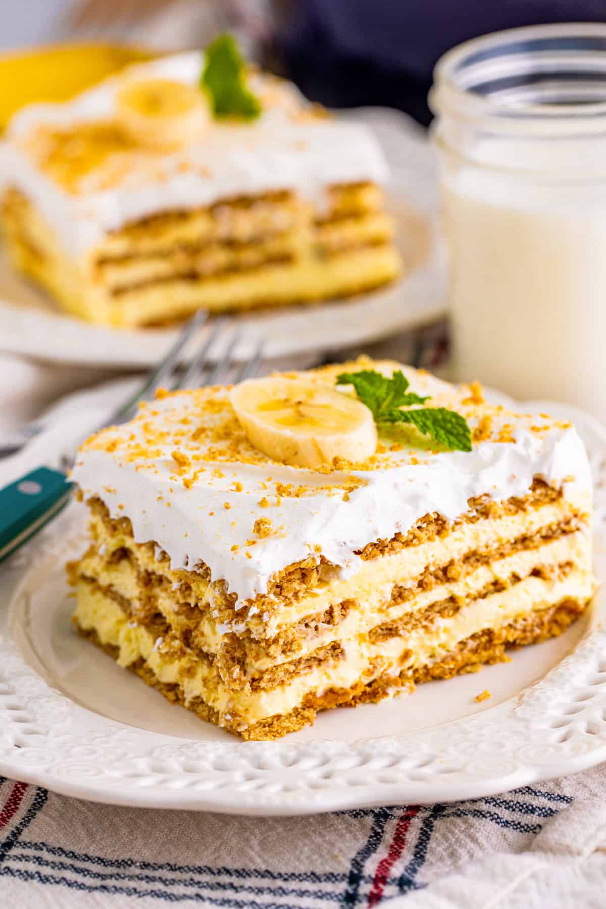 Banana icebox cake with layers of banana pudding, graham crackers, and cool whip.