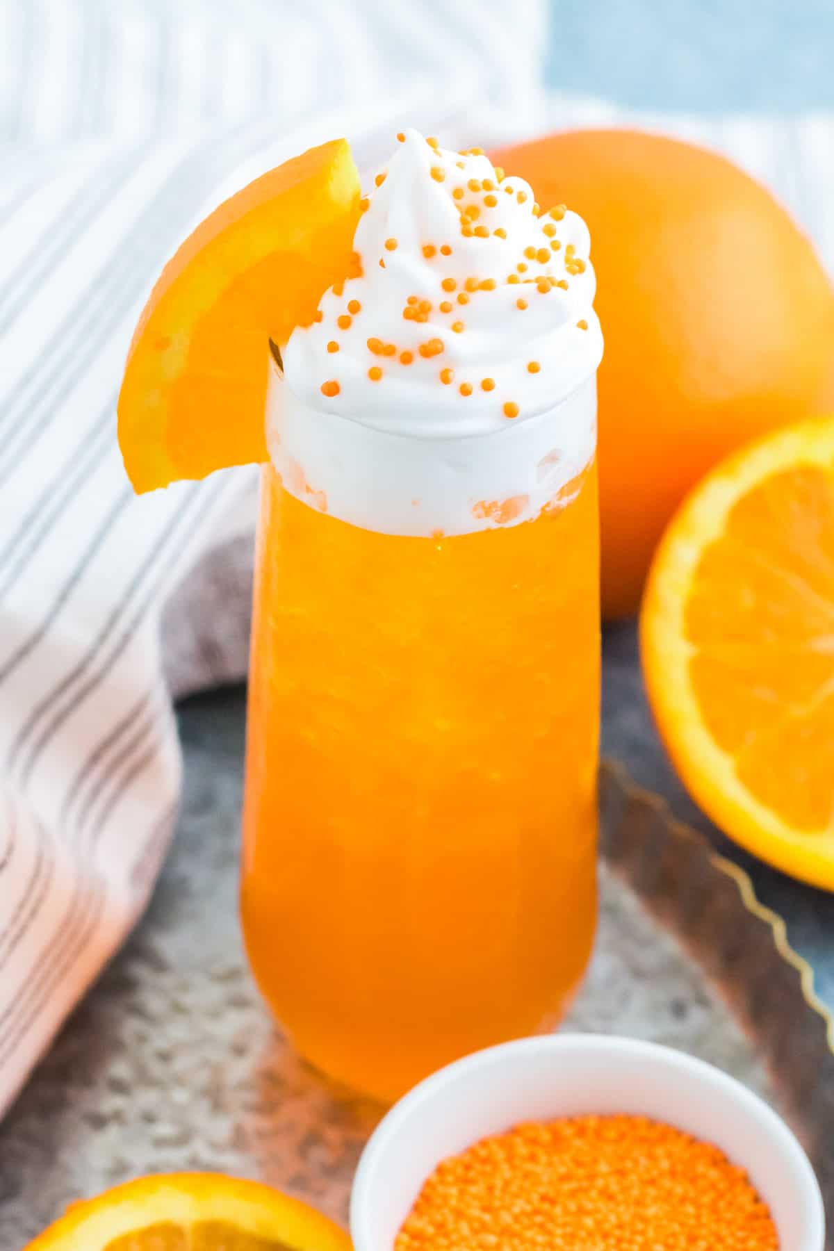 Creamsicle drink recipe with vodka, orange soda, and whipped cream.