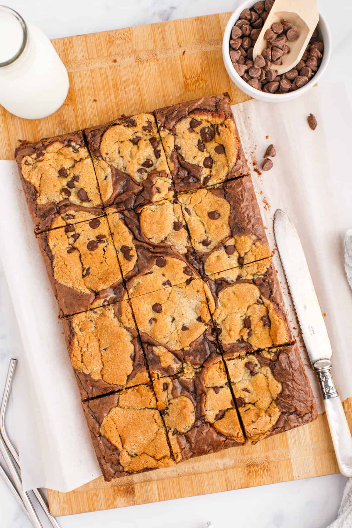 Sliced brookie cookie bars on cutting board.