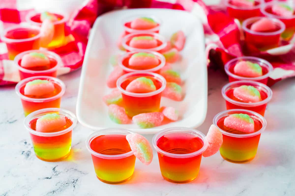 Watermelon Jello Shots displayed neatly on a table.