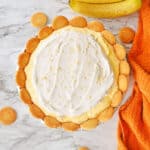 Banana pudding pie with cool whip and nilla wafers on top.