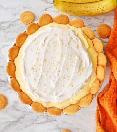 Banana pudding pie with cool whip and nilla wafers on top.