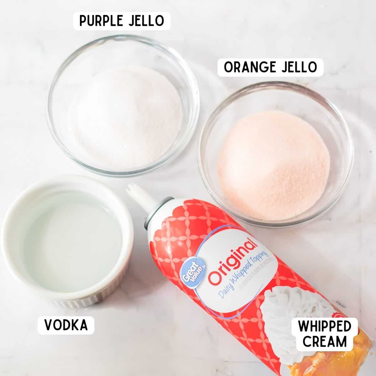 Ingredients for Halloween shots: orange jello, purple jello, whipped cream, vodka.