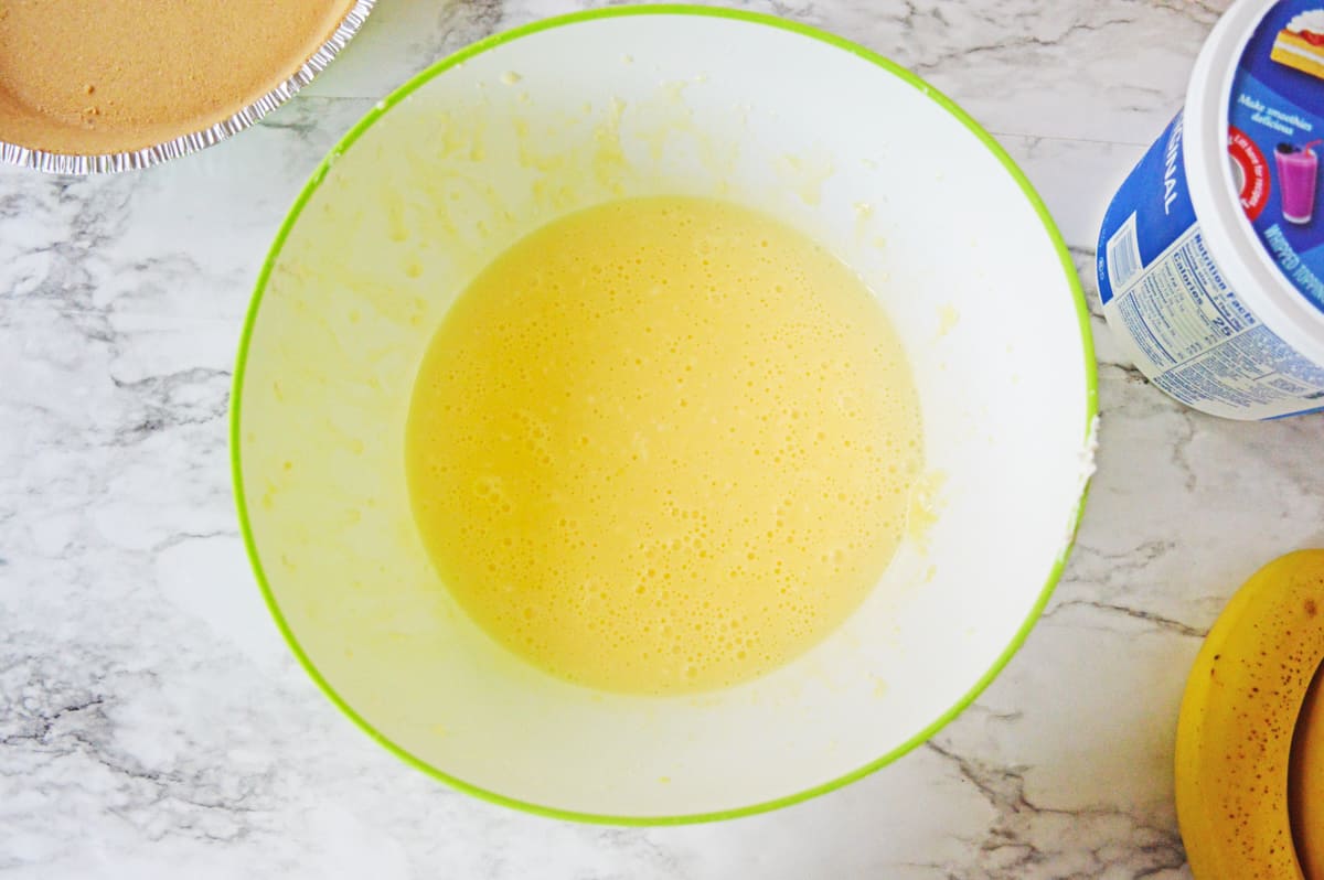 Cream cheese and pudding mixture in large mixing bowl.