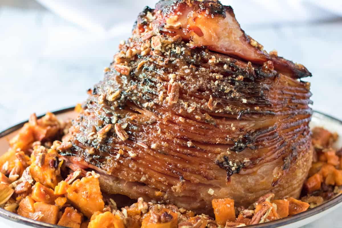 Glazed ham with crushed pecans and sweet potatoes.