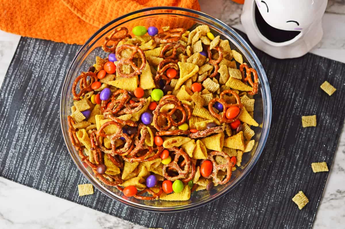 Halloween snack mix in a large glass bowl.