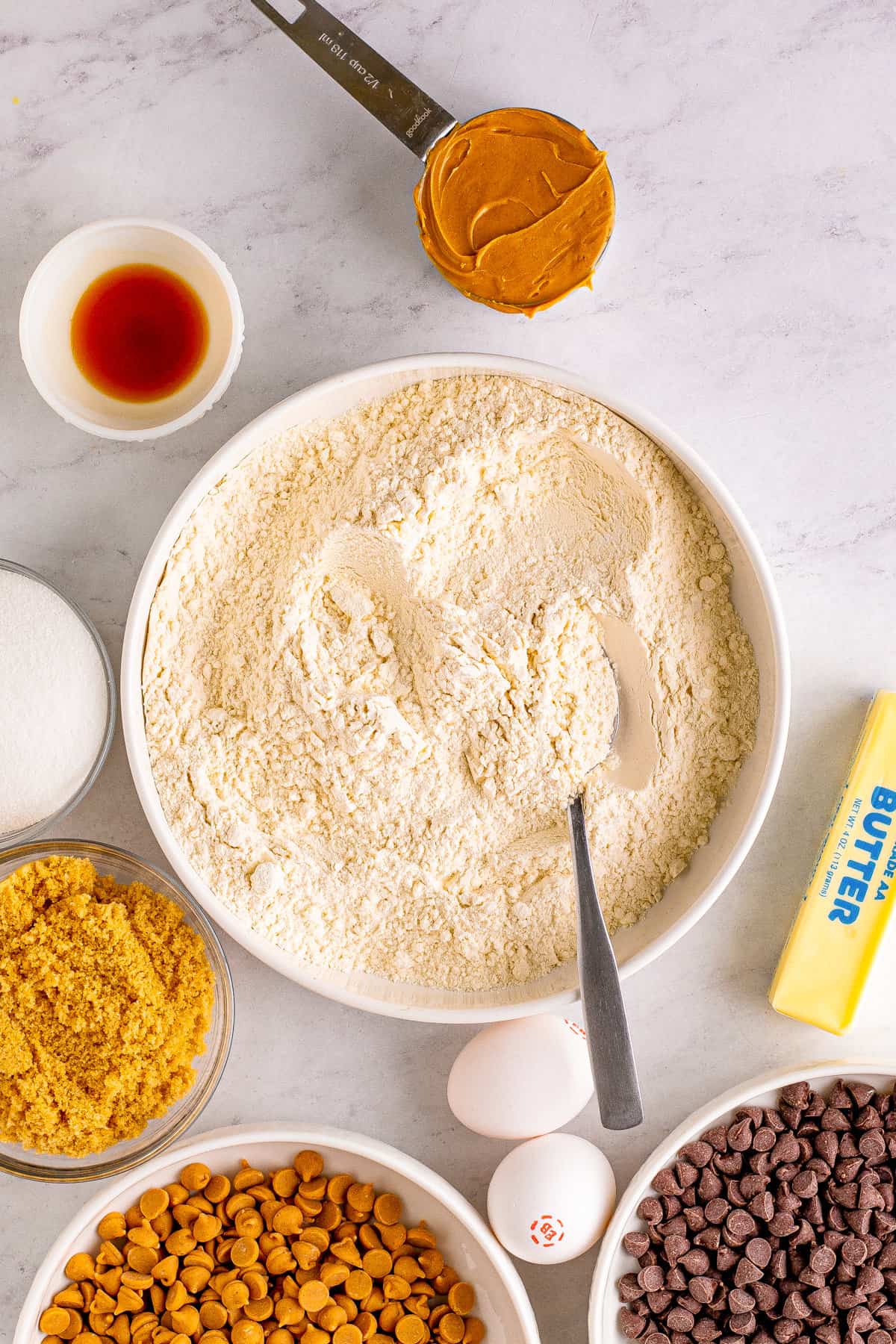 Bowl of dry ingredients with spoon.