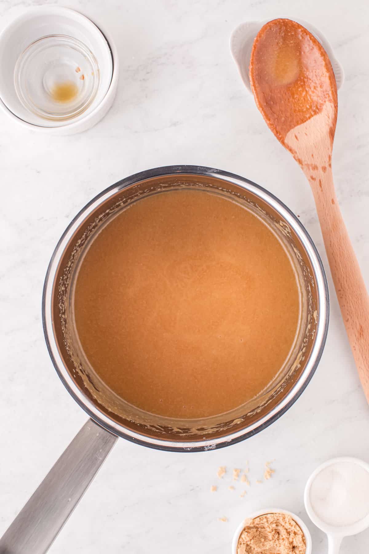 Saucepan with smooth caramel sauce.