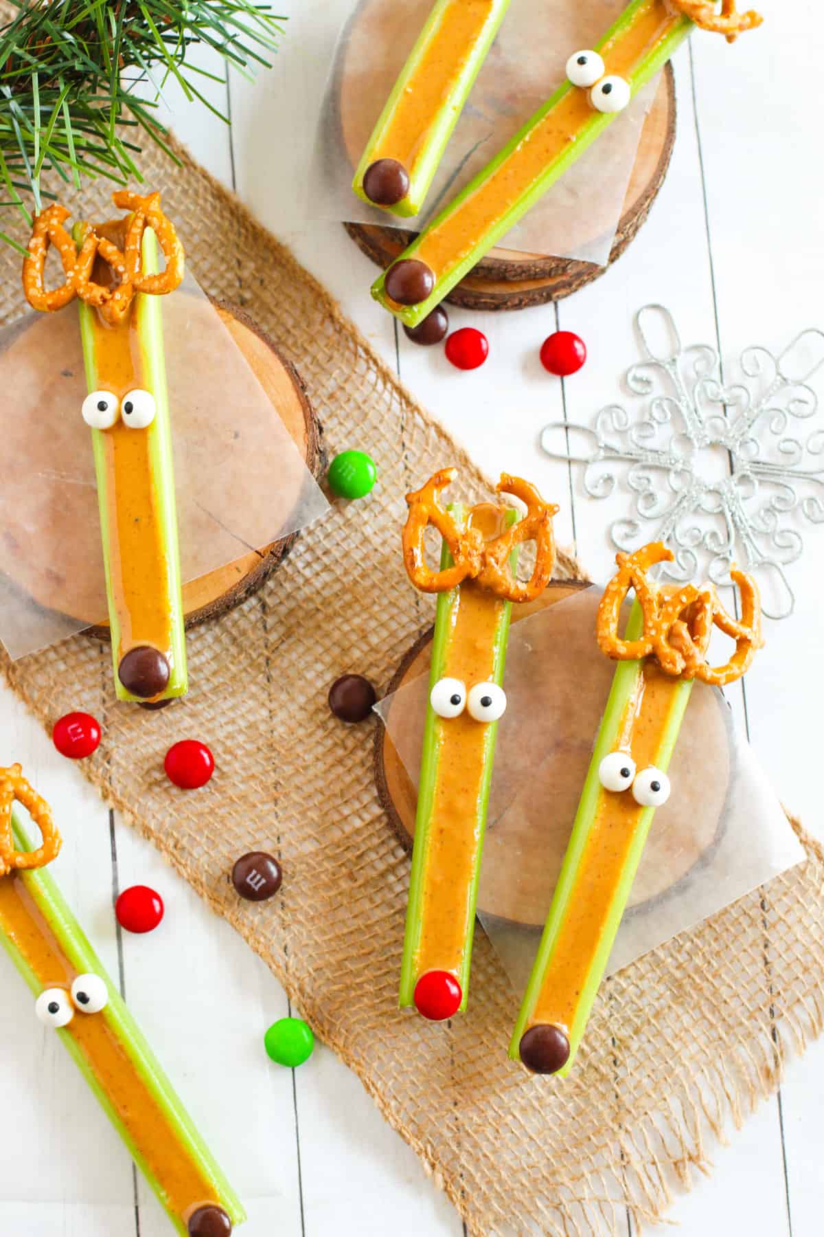 Reindeer celery sticks with peanut butter filling, pretzel antlers,candy eyes, and M&M candy noses.