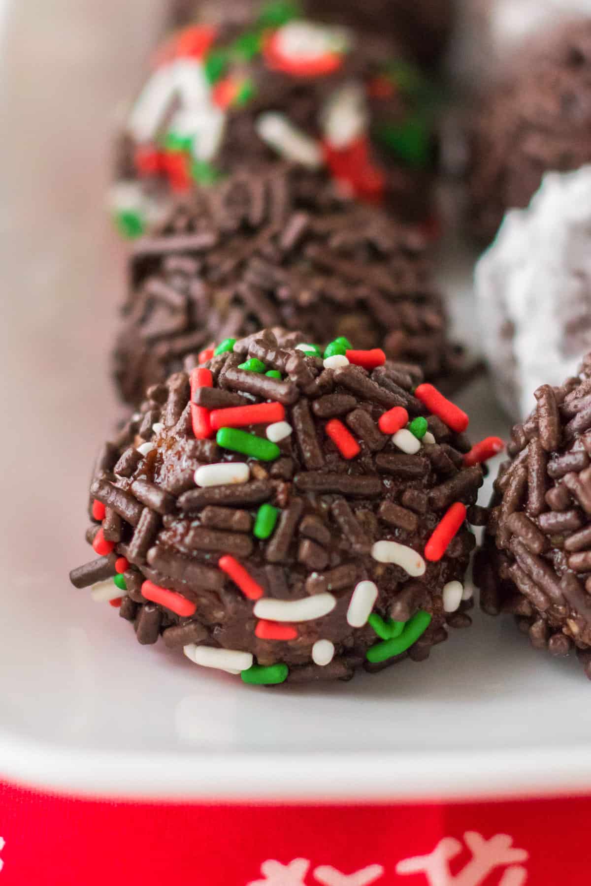 Classic rum ball with holiday sprinkles.