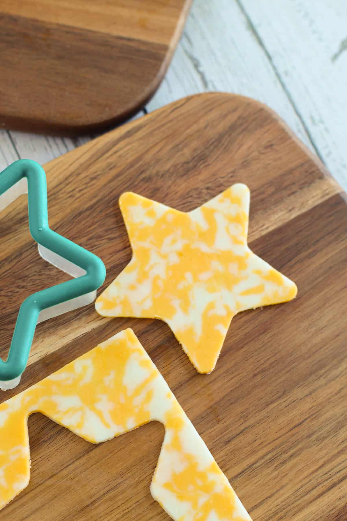 Star cut out of slice of cheese with a cookie cutter.