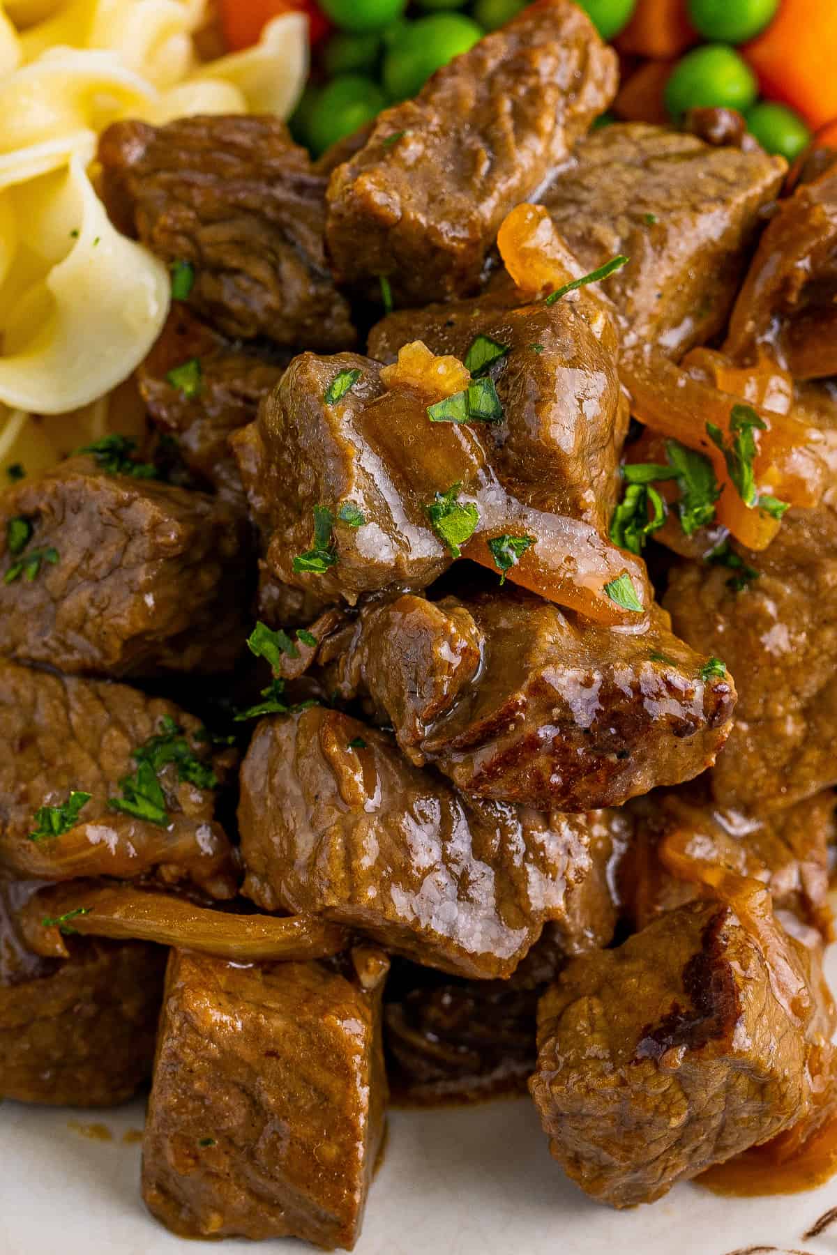 Close up of beef tips cooked in slow cooker.