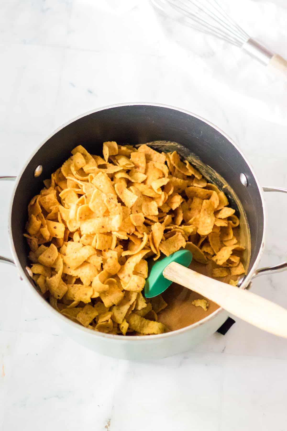 Fritos added to saucepan.