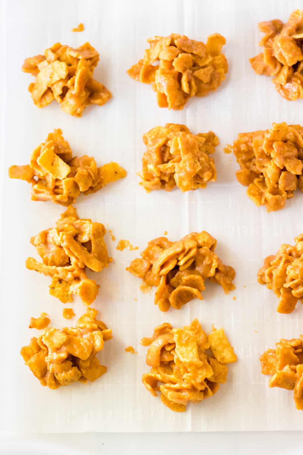 Fritos peanut butter clusters on lined tray.