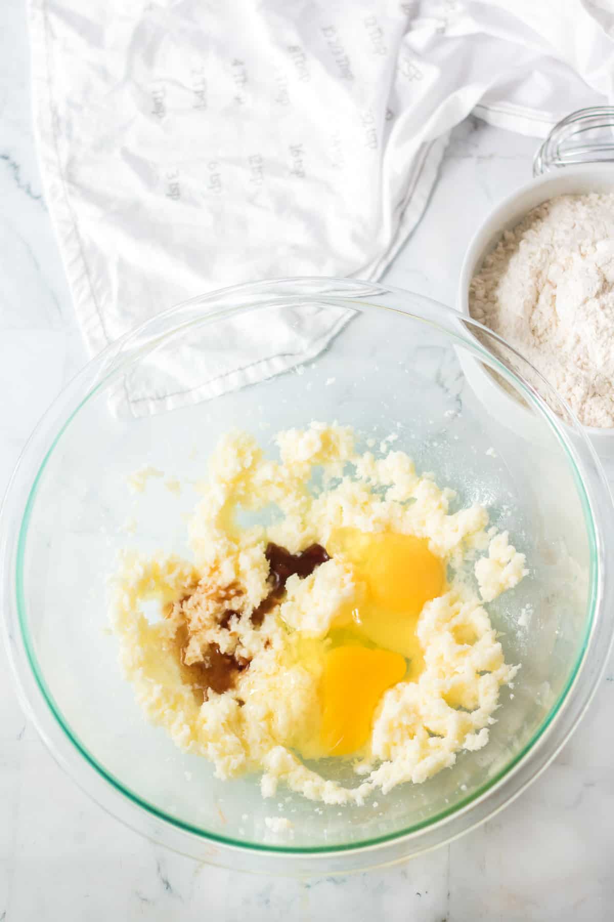 Eggs and vanilla added to mixing bowl.