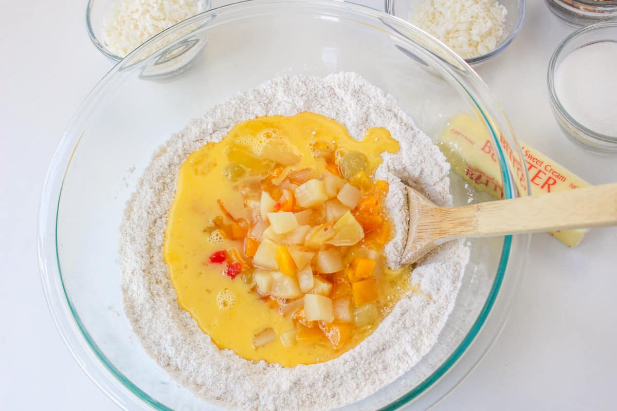 Fruit cocktail added to mixing bowl.