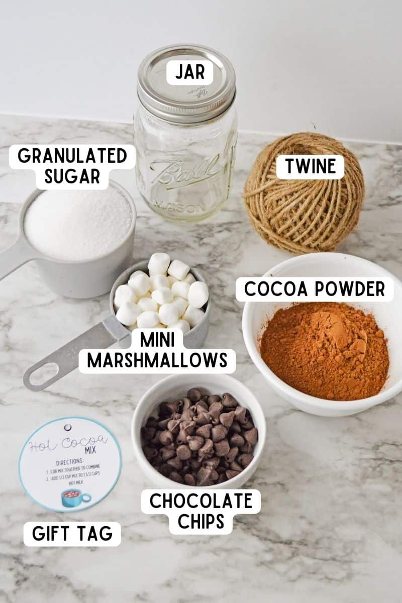 Ingredients and supplies for hot cocoa mix in a jar.