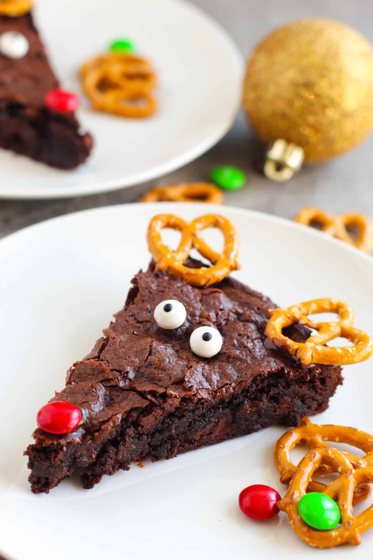Reindeer Brownies with pretzel antlers, candy eyes, and a red M&M nose.