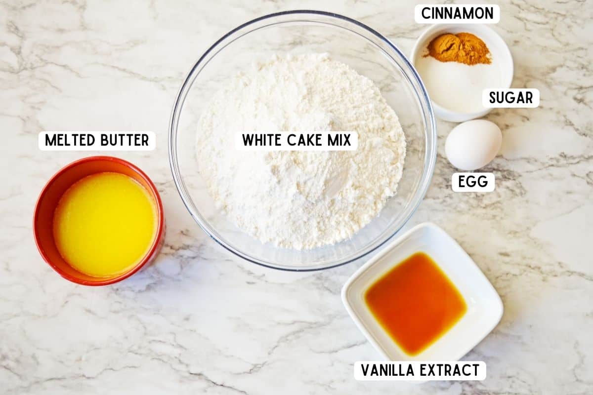 Melted butter, white cake mix, vanilla extract, 1 egg, cinnamon and granulated white sugar.