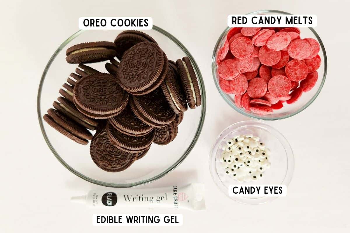 Ingredients for oreo love bugs: oreo cookies, red candy melts, candy eyeballs, and edible black writing gel.