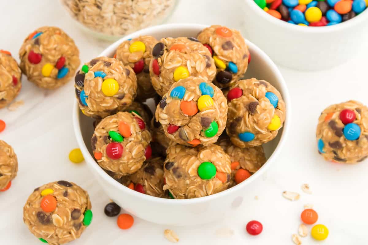 Bowl of oatmeal balls with chocolate chips and M&Ms.