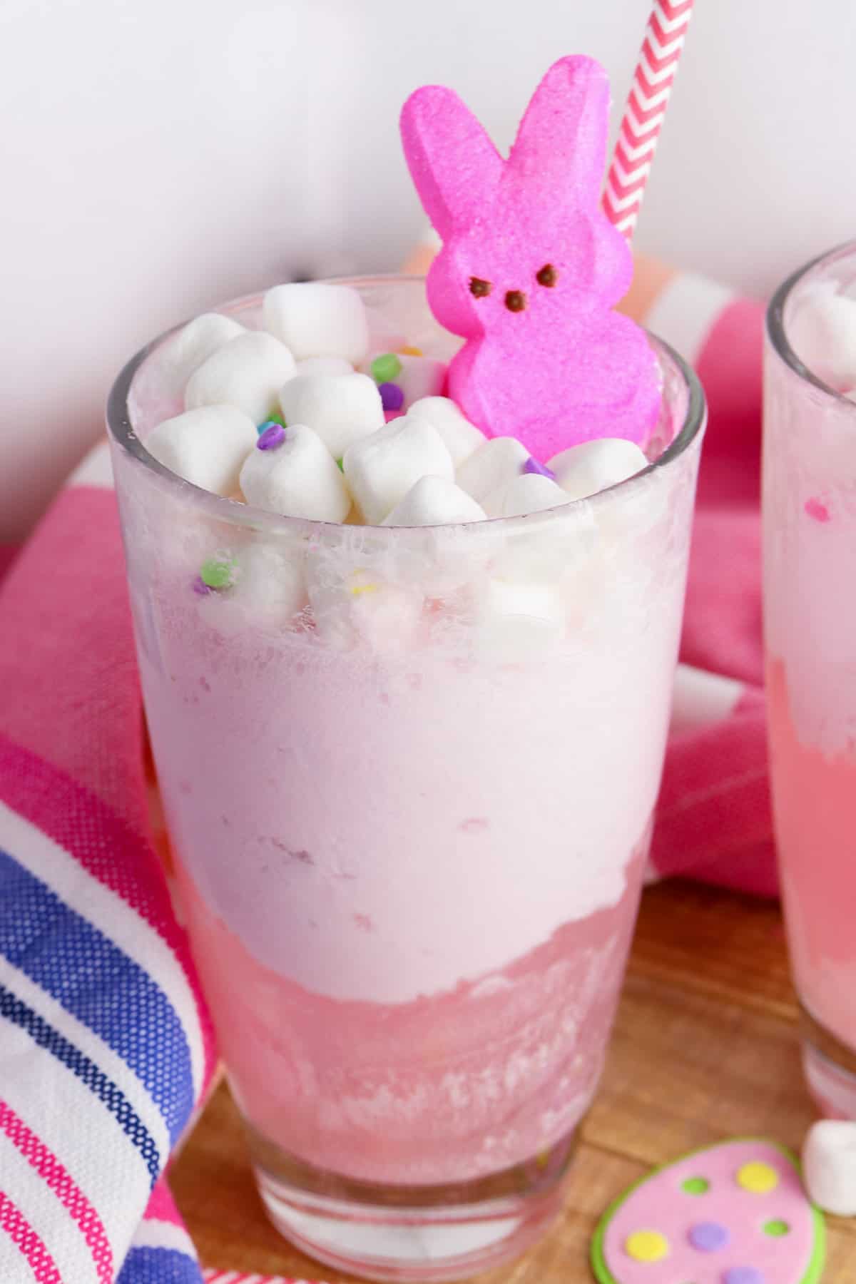 Pink Easter Bunny Punch with strawberry ice cream, soda, fruit juice, mini marshmallows, and a Peeps bunny.