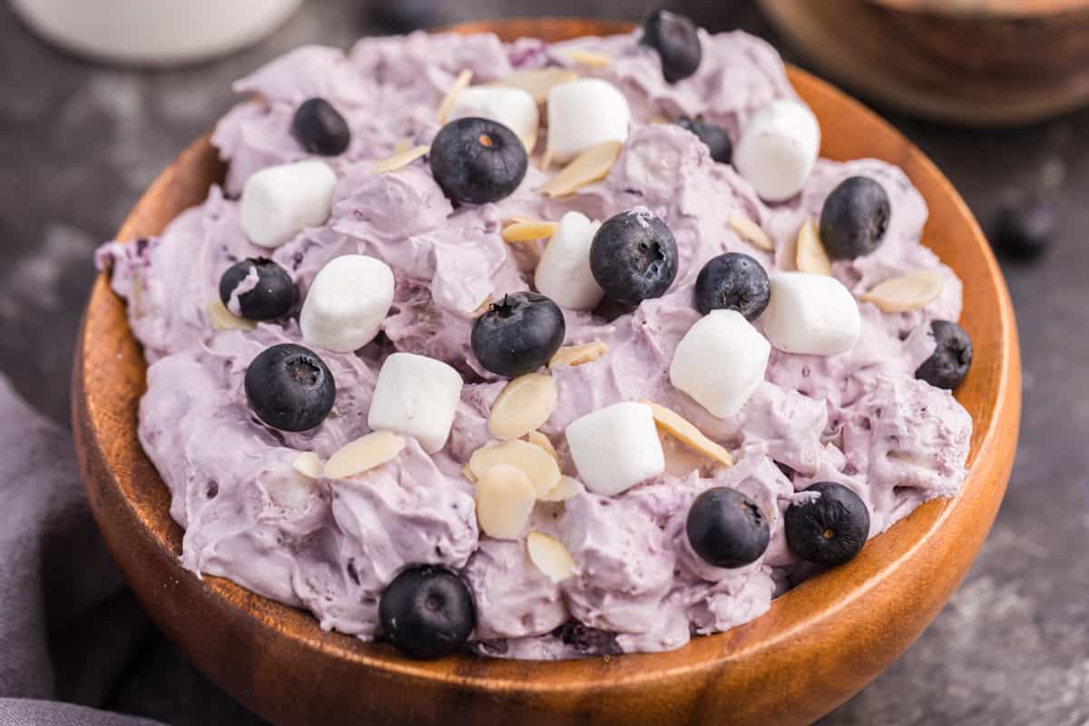 Blueberry fluff dessert salad in wooden bowl.