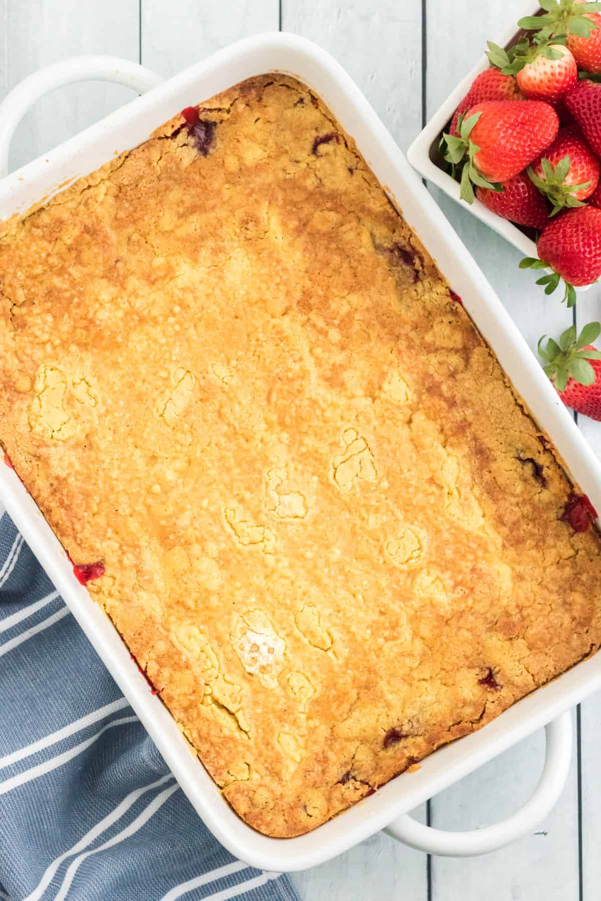 Strawberry dump cake baked until golden brown.