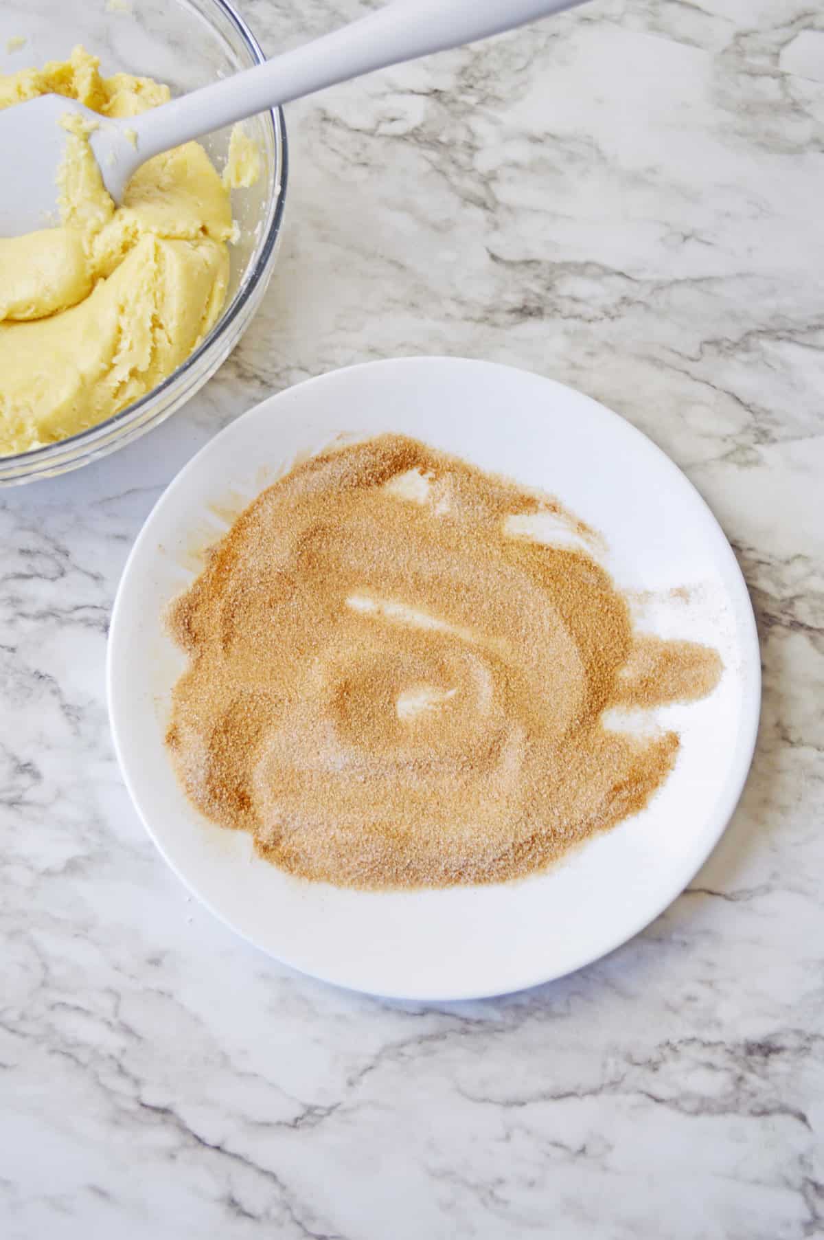 Cinnamon sugar on a saucer.