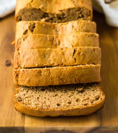 The best easy banana bread on a cutting board and cut into slices.