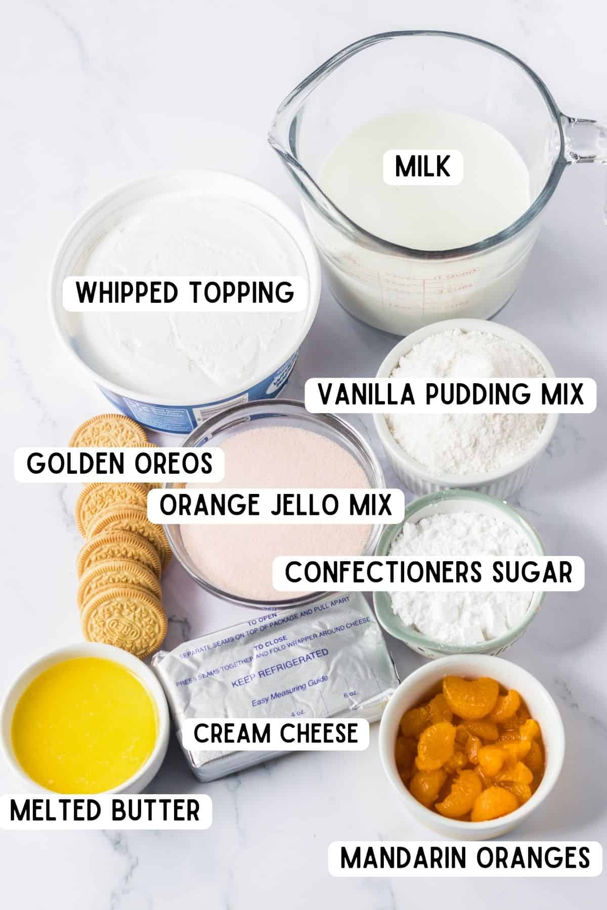 Whipped topping, milk, vanilla pudding mix, orange jello mix, confectioners sugar, golden oreos, cream cheese, mandarin orange pieces, melted butter, whipped topping, cream cheese.