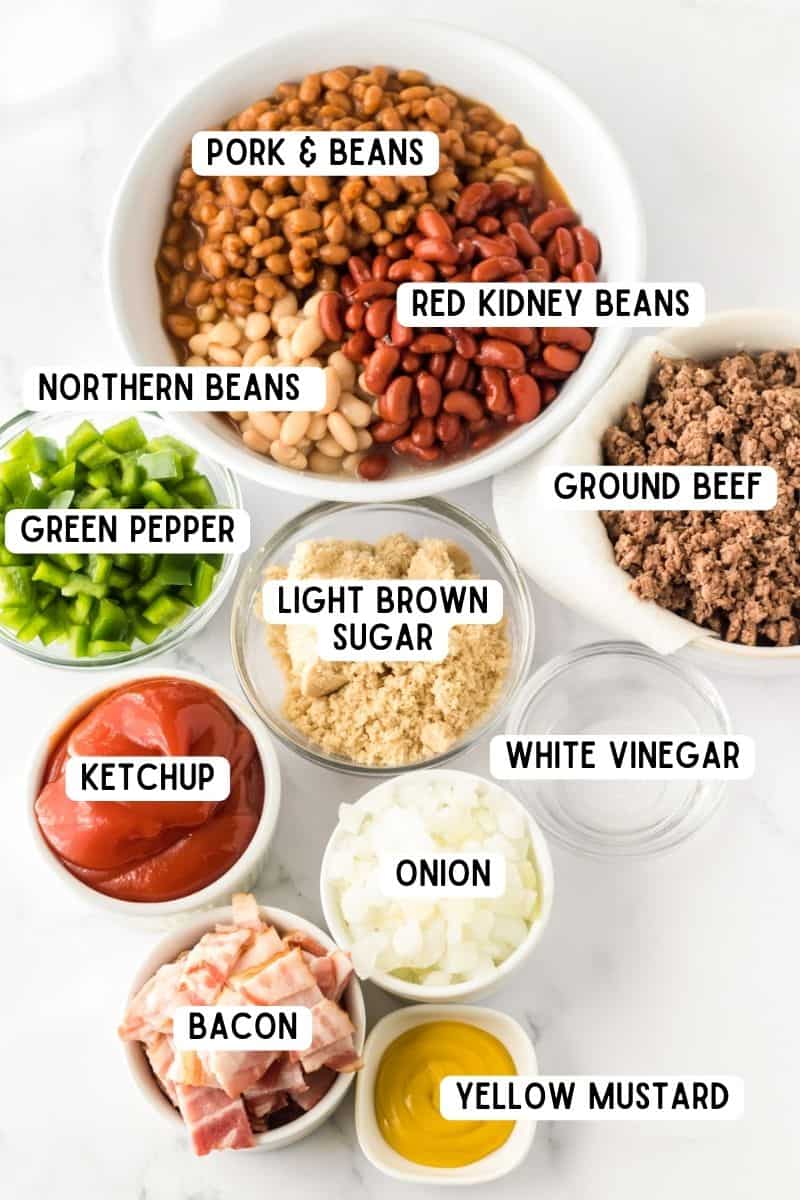 Red kidney beans, northern beans, poke and beans, diced onion, diced green pepper, light bron sugar, ketchup, cooked ground beef, white vinegar, yellow mustard, and chopped bacon.