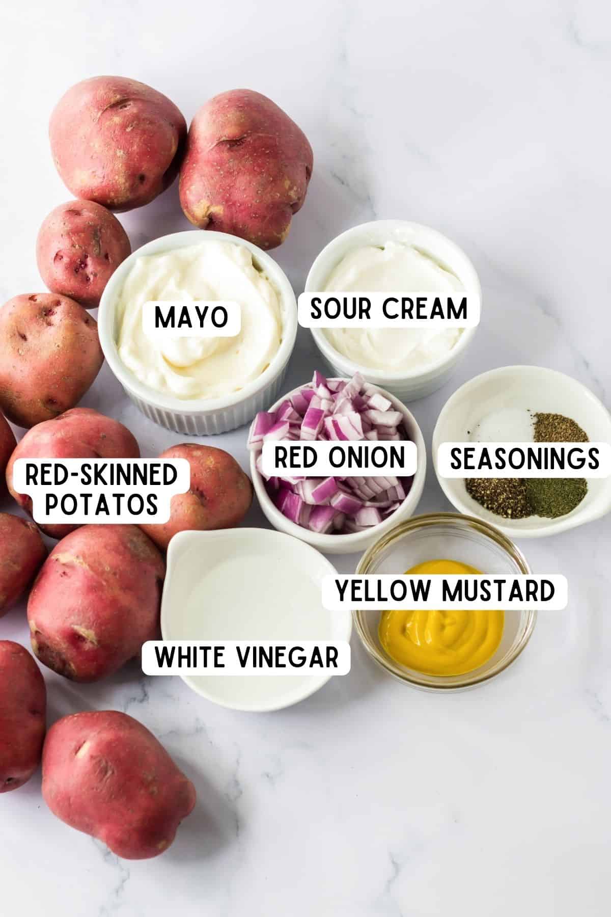 Red potatoes, mayo, sour cream, red onion, yellow mustard, white vinegar, and seasonings.
