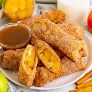Apple pie egg rolls with apple pie filling and caramel sauce for dipping.