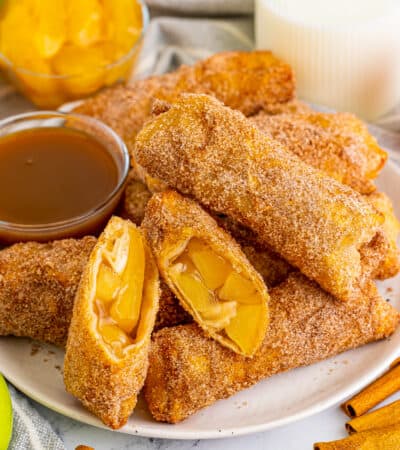 Apple pie egg rolls with apple pie filling and caramel sauce for dipping.
